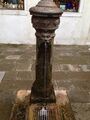 Metal fountain with rust and algae